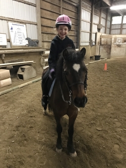 Ella riding her pony, Rainbow!